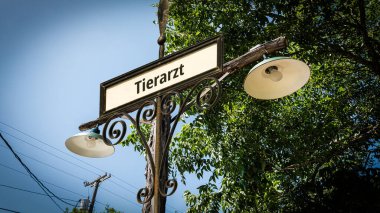Almanca bir tabelayla veterineri gösteren bir resim..