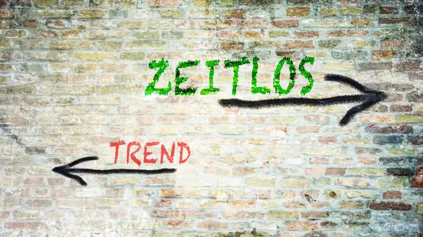 Almanca 'nın iki farklı yönünü gösteren işaret direği olan bir resim. Bir yön Zamansız 'ı, diğeri Trend' i gösteriyor.