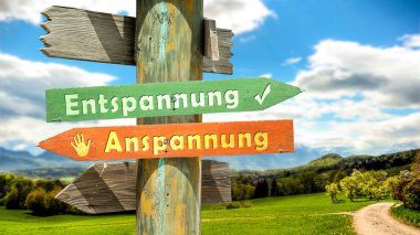 Almanca 'nın iki farklı yönünü gösteren işaret direği olan bir resim. Bir yön gevşemeye, diğer yön gerilime işaret ediyor..