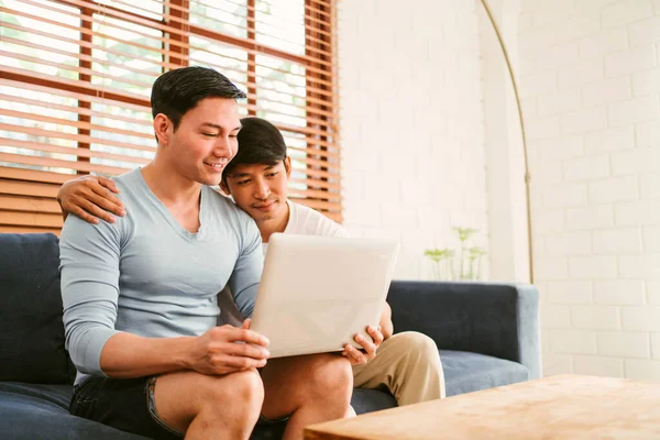 Happy Millennial Asian Gay Couple Sitting Sofa While Watching Content — Stock Photo, Image