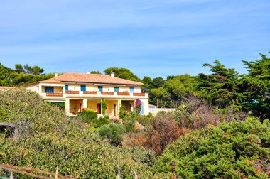 View of Giens Peninsula close to Porquerolles. Rocky Cliffs and Turquoise Waters of the French Mediterranean clipart