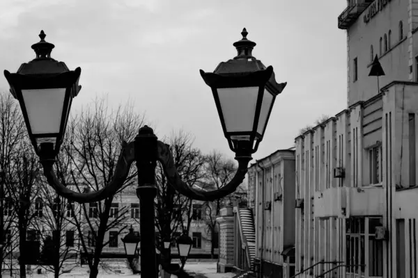 Black and white photo of a street lighting lantern made in retro style