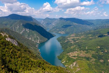 View of Lake Perucac on the Drina River from the Banjska Stena viewpoint in Serbia on a sunny summer day. clipart