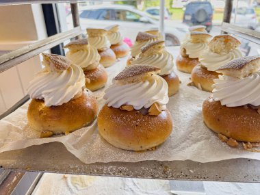 Delicious freshly baked semla or fastlagsbulle or laskiaispulla or vastlakukkel or fastelavnsbolle