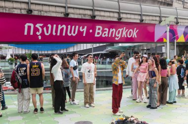 Bangkok, Thailand - August 3, 2024 : Group of tourists selfie at famous location a wording 