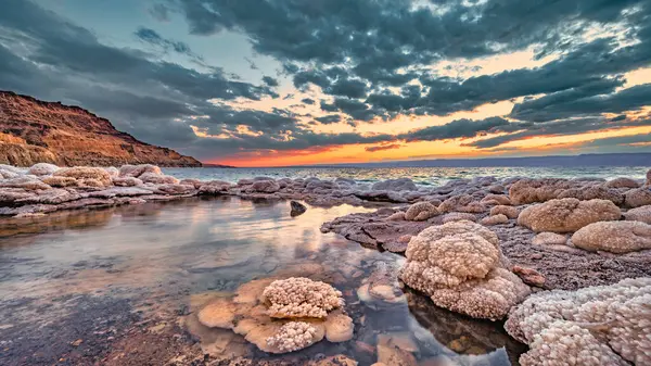 Sunset over salt formations on the Jordanian coast of the Dead Sea.