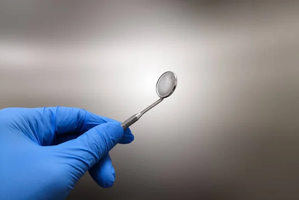 stock image Closeup Image Of Dentist Holding Dental Mirror With Gloved Hand