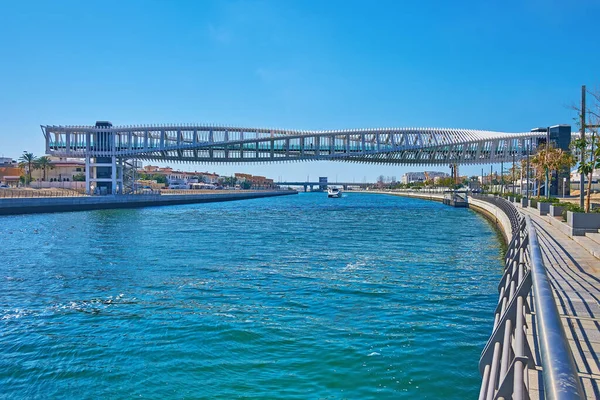 The white twisted metal construction of Water Canal Footbridge across Dubai Water Canal, Dubai, UAE