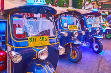 CHIANG MAI, THAILAND - MAY 3, 2019: Closeup of parked blue tuk tuks, on May 3 in Chiang Mai