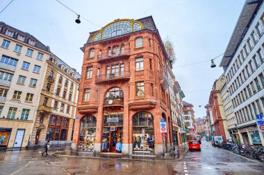 BASEL, SWITZERLAND - APRIL 1, 2022: Modest facade of trading building on Fischmarkt square, on April 1 in Basel, Switzerland
