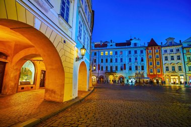 PRAGUE, CZECHIA - MARCH 11, 2022: Evening stroll in Stare Mesto district and enjoy great medieval townhouses in various styles, on March 11 in Prague, Czechia