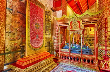 CHIANG MAI, THAILAND - MAY 3, 2019: The Buddha Footprint relic and the image of Reclining Buddha in Viharn Lai Kham of Wat Phra Singh, on May 3 in Chiang Mai