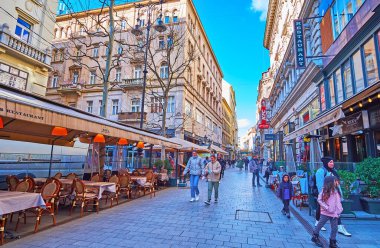 BUDAPEST, HUNGARY - FEB 22, 2022: The Vaci Street with outdoor restaurants, hotels, cafes and shops, on Feb 22 in Budapest