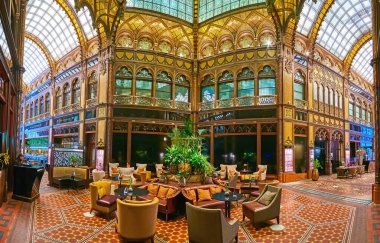BUDAPEST, HUNGARY - FEB 22, 2022: Interior of luxury restaurant in Paris Court (Brudern House) with stained glass windows and vault, carved wooden patterns, on Feb 22 in Budapest