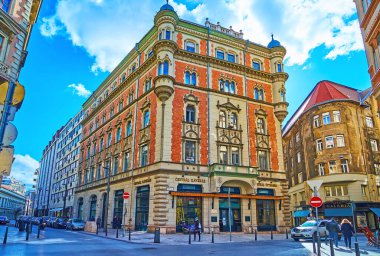 BUDAPEST, HUNGARY - FEB 22, 2022: Exterior of the vintage mansion with oriel windows, moulding and facade of famous Central Cafe, on Feb 22 in Budapest