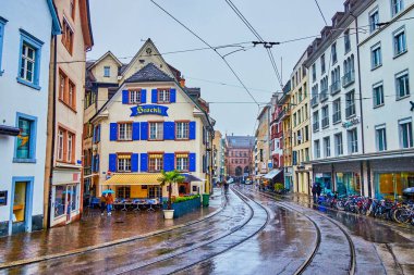 BASEL, SWITZERLAND - APRIL 1, 2022: Beautiful facade of traditional zum alten Stockli restaurant on Barfusserplatz square, on April 1 in Basel, Switzerland