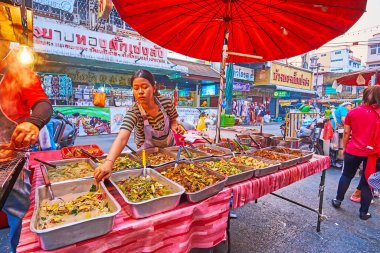 CHIANG MAI, THAILAND - MAY 3, 2019: The street food stall of Warorot Market with wide range of Thai vegetable dishes, on May 3 in Chiang Mai