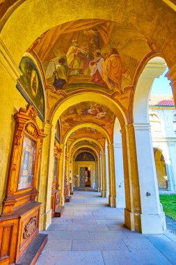 The arcaded corridor of the cloister with scenic medieva frescoes on ceilings, Loreta of Prague, Czechia