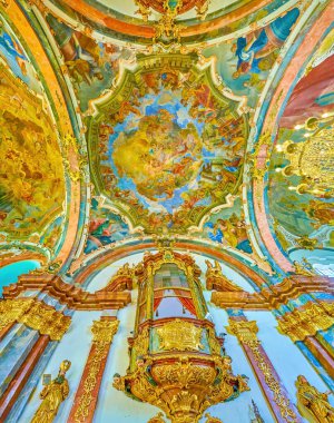 PRAGUE, CZECHIA - MARCH 11, 2022: Colorful historical interior of Church of the Nativity in Loreta, on March 11 in Prague, Czechia