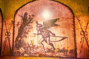 PRAGUE, CZECHIA - MARCH 11, 2022: The fresco of Chronos with scythe in the model of Crypt of Prague Loreta, on March 11 in Prague, Czechia