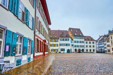BASEL, SWITZERLAND - APRIL 1, 2022: Traditioanl houses on Munsterplatz square, on April 1 in Basel, Switzerland