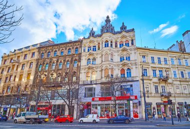 BUDAPEST, HUNGARY - FEB 22, 2022: Karoly Boulevard with historic townhouses and ornate Severa House, decorated with stucco and mosaic pictures, on Feb 22 in Budapest