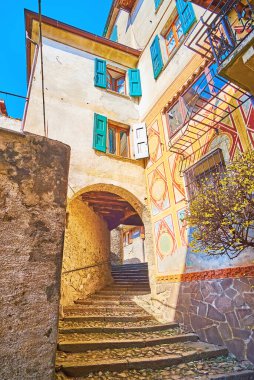 The mountain settlement of Castello consists of the narrow curved ascents and descents with stone stairs and arched passages under the houses, Valsolda, Italy