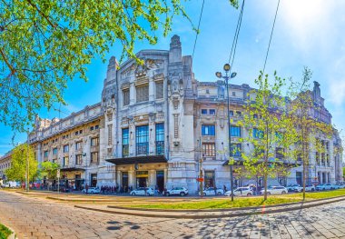 MILAN, ITALY - APRIL 11, 2022: Panorama of the side facade of Milano Centrale train station facing Piazza Quattro Novembre, on April 11 in Milan, Italy