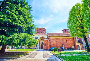 The courtyard of Basilica of Sant'Ambrogio complex with ancient churches and other buildings, Milan, Italy