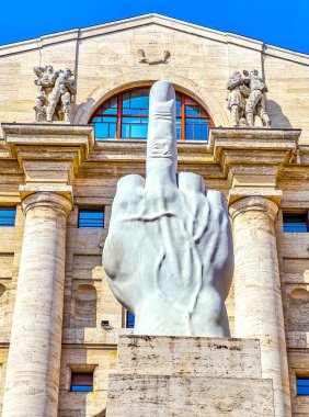 MILAN, ITALY - APRIL 11, 2022: The modern culpture L.O.V.E. or Il Dito (the finger) by Maurizio Cattelan on Piazza Affari, on April 11 in Milan, Italy
