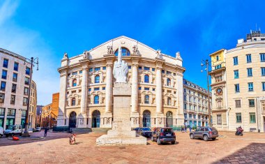 MILAN, ITALY - APRIL 11, 2022: Panorama of Piazza Affari the financial heart of the city with modern sculpture L.O.V.E. by Maurizio Cattelan, on April 11 in Milan, Italy