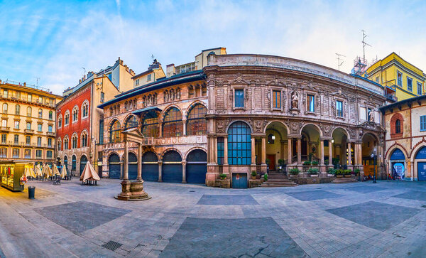 MILAN, ITALY - APRIL 11, 2022: Panorama of Piazza Mercanti (Merchants Square) withhistorical palaces and medieval well in the middle, on April 11 in Milan, Italy