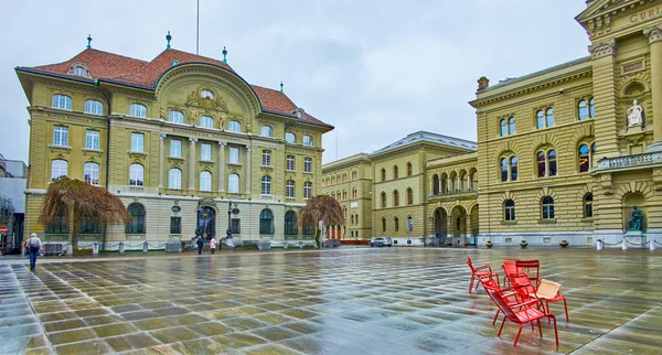 Swiss National Bank on Bundesplatz square next to Bundeshaus (Federal Palace) building in Bern, Switzerland