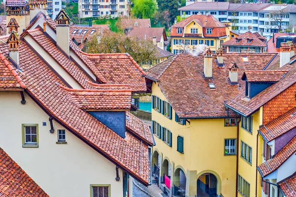 stock image Iconic Bernese red tiled roofs of medieval townhouses, located on Nydeggstalden street, Switzerland