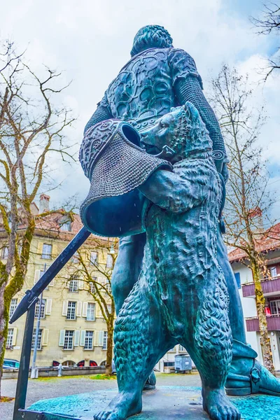 The bronze bear holding chain mail helmet, the part of Zahrindenkmal monument in Bern, Switzerland