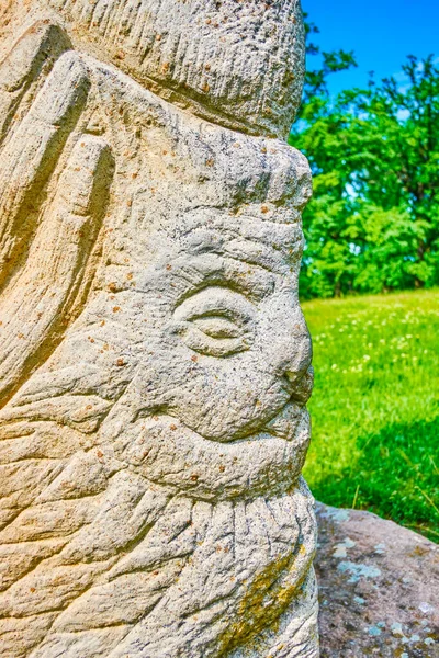 The images of the ancient Gods on Pagan Slavic Idol sculpture, Sofiyivka Park arboretum, Uman, Ukraine