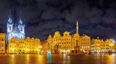 Enjoy the panorama of the evening Old Town Square with Tyn Church, Marian Column and historic housing, Prague, Czechia clipart