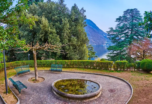 Relax in a beautiful green garden with fountain, observing Lake Lugano and mountains, Castagnola, Lugano, Switzerland