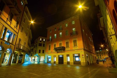 LUGANO, SWITZERLAND - MARCH 17, 2022: Piazzetta Emilio Maraini at night, on March 17 in Lugano, Switzerland clipart