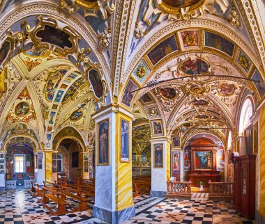 ORSELINA, SWITZERLAND - MARCH 26, 2022: The outstanding interior of historic Madonna del Sasso Sanctuary with frescoes, stucco garlands and relief patterns, Orselina, Switzerland clipart