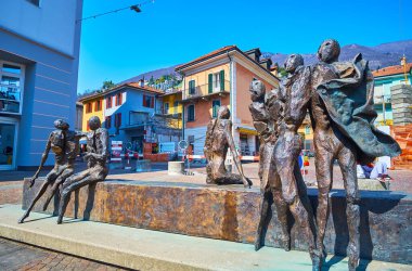 LOCARNO, SWITZERLAND - MARCH 26, 2022: Impressive sculptural group La Visita by Nag Arnoldi on Via dell'Ospedale in front of La Carita Hospital, Locarno, Switzerland clipart
