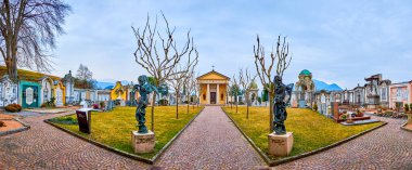 COLLINA D'ORO, SWITZERLAND - MARCH 18,2022: Panorama of monumental cemetery of Sant'Abbondio, on March 18 in Collina d'Oro, Switzerland clipart