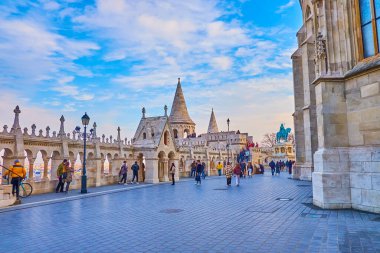 Take a walk along the beautiful stone Fisherman's Bastion and enjoy the views of Budapest and Matthias Church, Hungary clipart