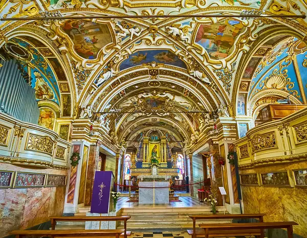 stock image ORSELINA, SWITZERLAND - MARCH 26, 2022: The main altar of Santa Maria Assunta Church of Madonna del Sasso Sanctuary, surrounded with outstanding decorations, Orselina, Switzerland