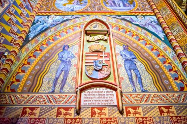 BUDAPEST, HUNGARY - FEBRUARY 28, 2022: Colored medieval frescoes in Matthias Church, on February 21 in Budapest, Hungary clipart
