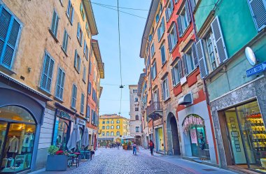BERGAMO, ITALY - APRIL 7, 2022: Take a walk down the old Via Sant'Alessandro, located in Citta Bassa (lower town), Bergamo, Italy clipart