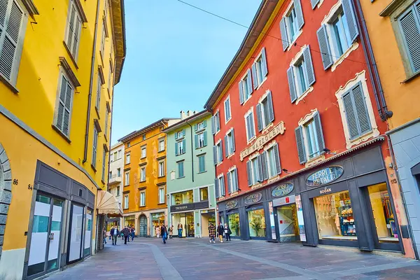 stock image BERGAMO, ITALY - APRIL 7, 2022:  Via XX Settembre boasts tourist shops, brand boutiques and lots of cafes and restaurants, Bergamo, Italy