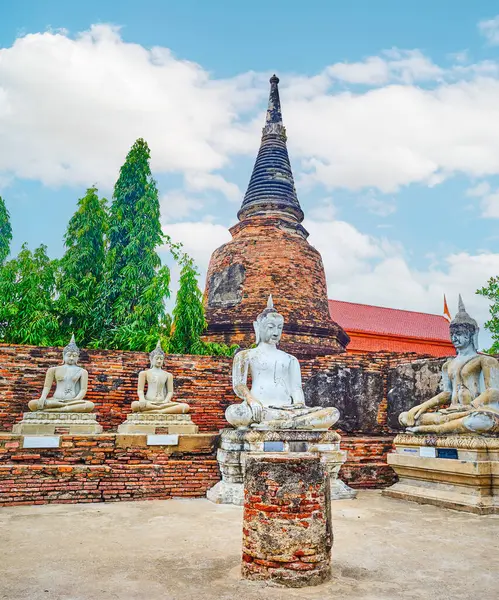 stock image The line of statues of Sitting Buddha on grounds of ancient Wat Yai Chai Mongkhon Temple, Ayutthaya, Thailand