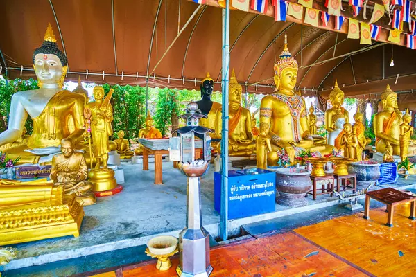 stock image The outdoor shrine with sculptures of golden Buddhas at Wat Phukhao Thong temple, Ayutthaya, Thailand