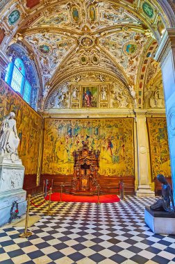 BERGAMO, ITALY - APRIL 7, 2022: Decorations of the walls and vault of medieval Basilica of Santa Maria Maggiore and the statue on the grave of Gaetano Donizetti, Bergamo Alta, Italy clipart